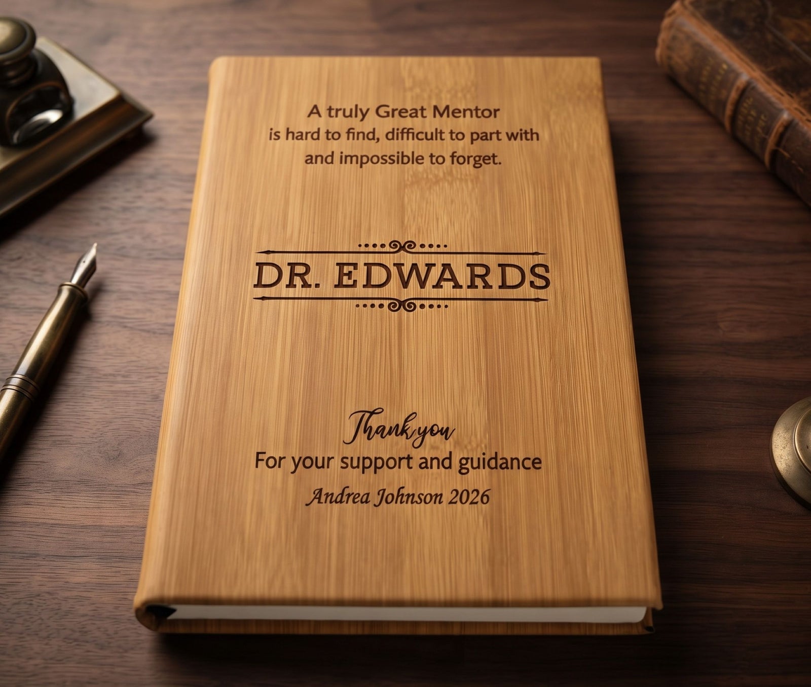 A personalized bamboo mentor guidebook engraved with 'DR. EDWARDS' and a thank you message, displayed on a dark wooden desk with vintage props.