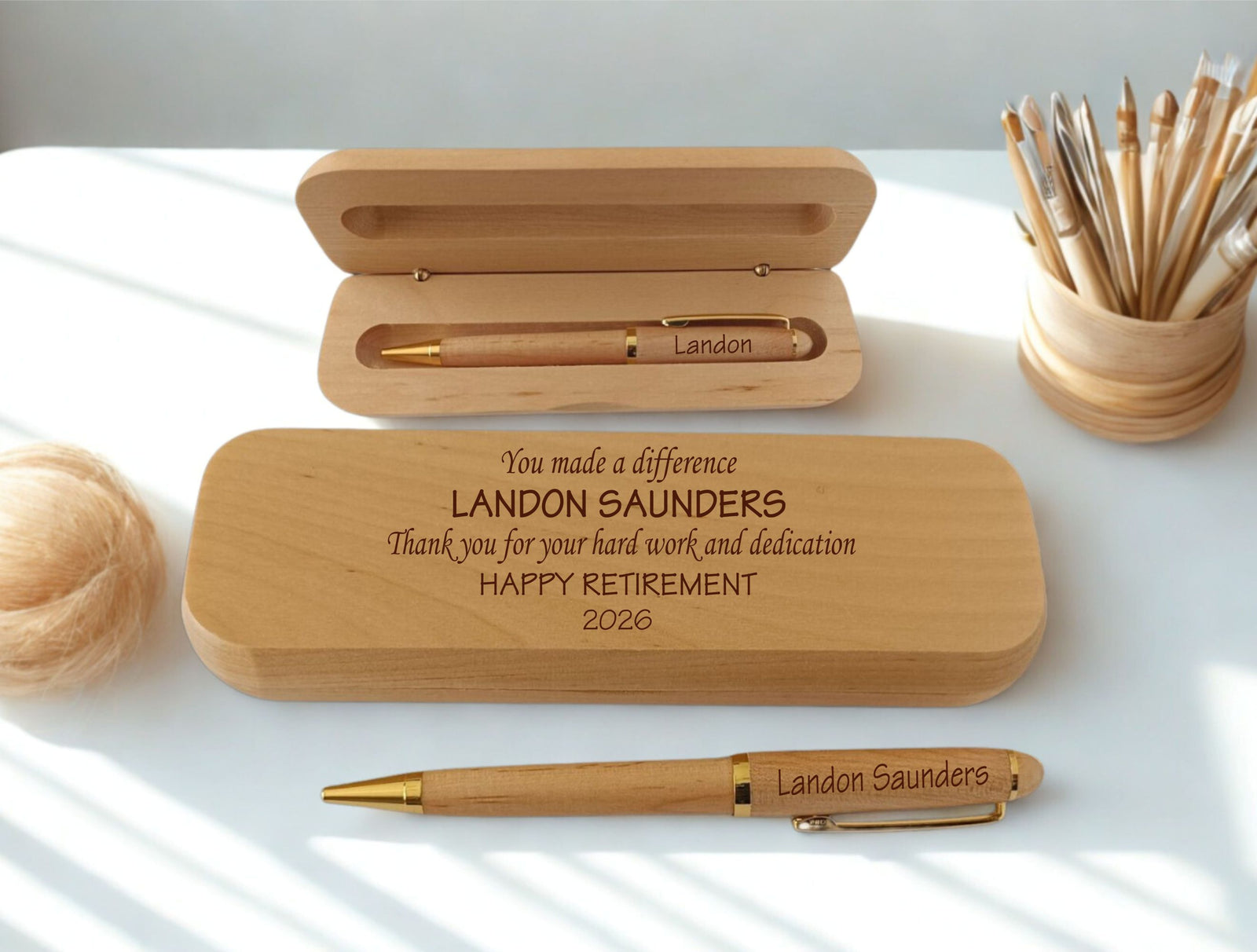 Custom engraved maple wood pen and case set. Personalized with the name and the message 'You made a difference – Thank you for your hard work and dedication – Happy Retirement 2026