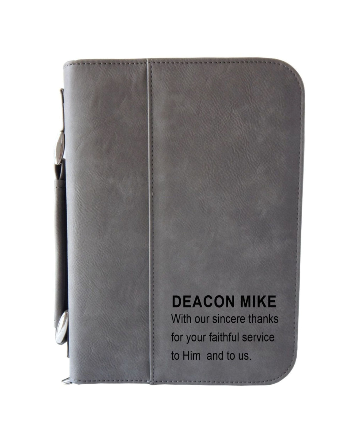 A personalized engraved leather Bible cover with a zipper, in gray color, with the inscription 'Deacon Mike' along with a blessing and thanksgiving message.
