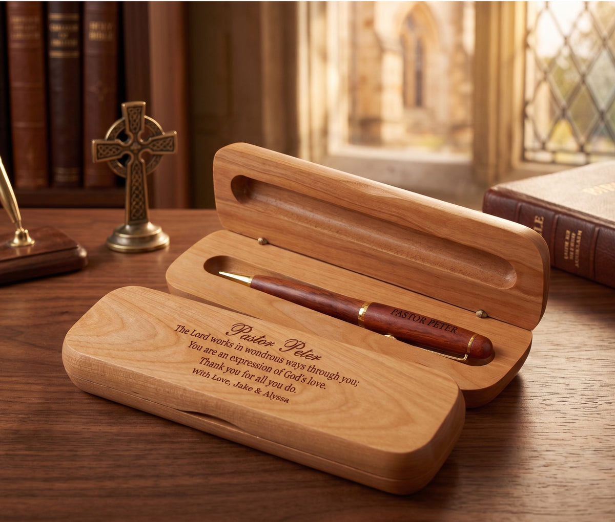 A personalized wooden pen gift set with a matching engraved wooden case, displayed on a wooden table in a warm, book-filled room setting.