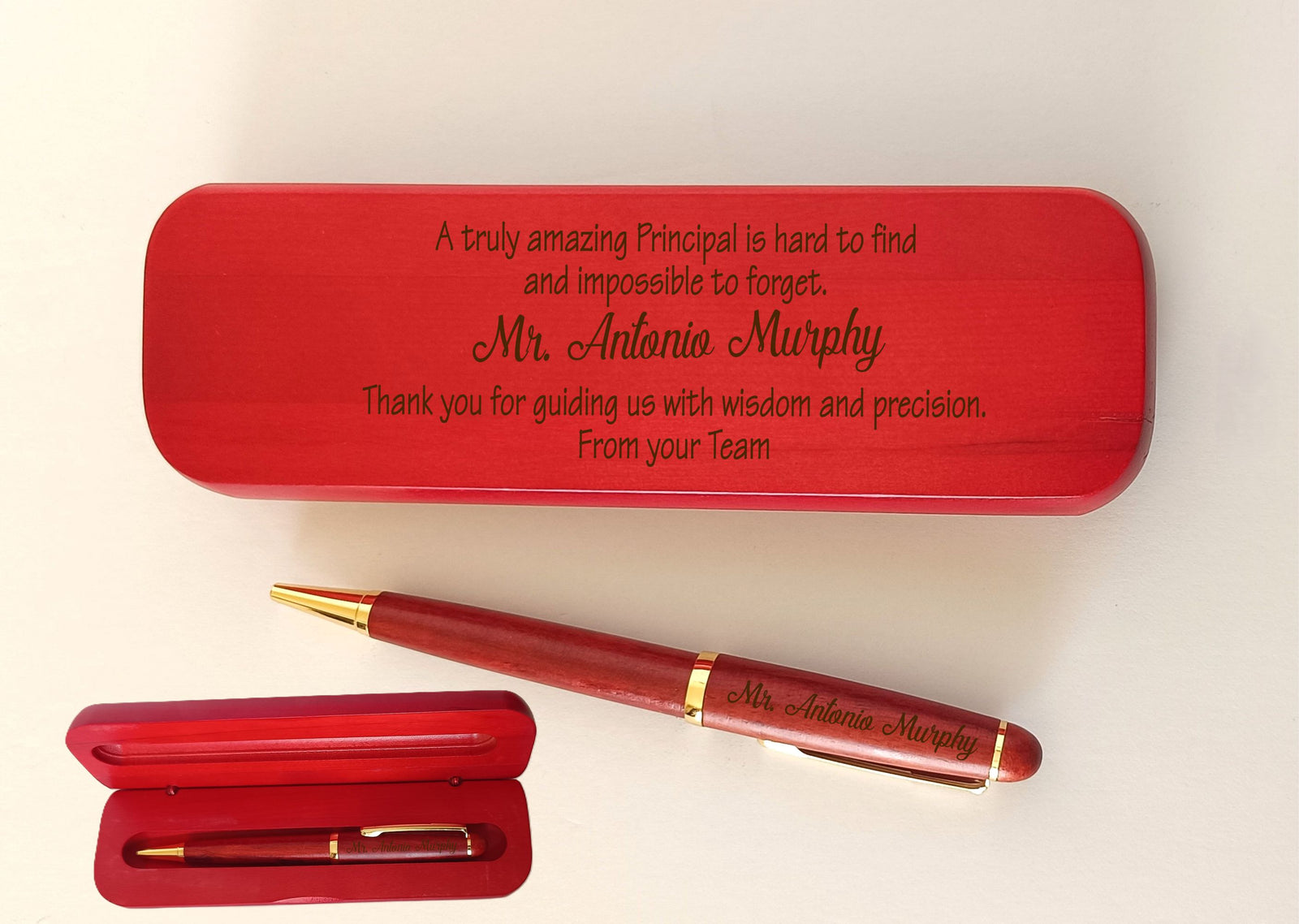 A personalized rosewood wooden pen gift set with matching cases, featuring engraved text for a principal, shown on a plain white background.