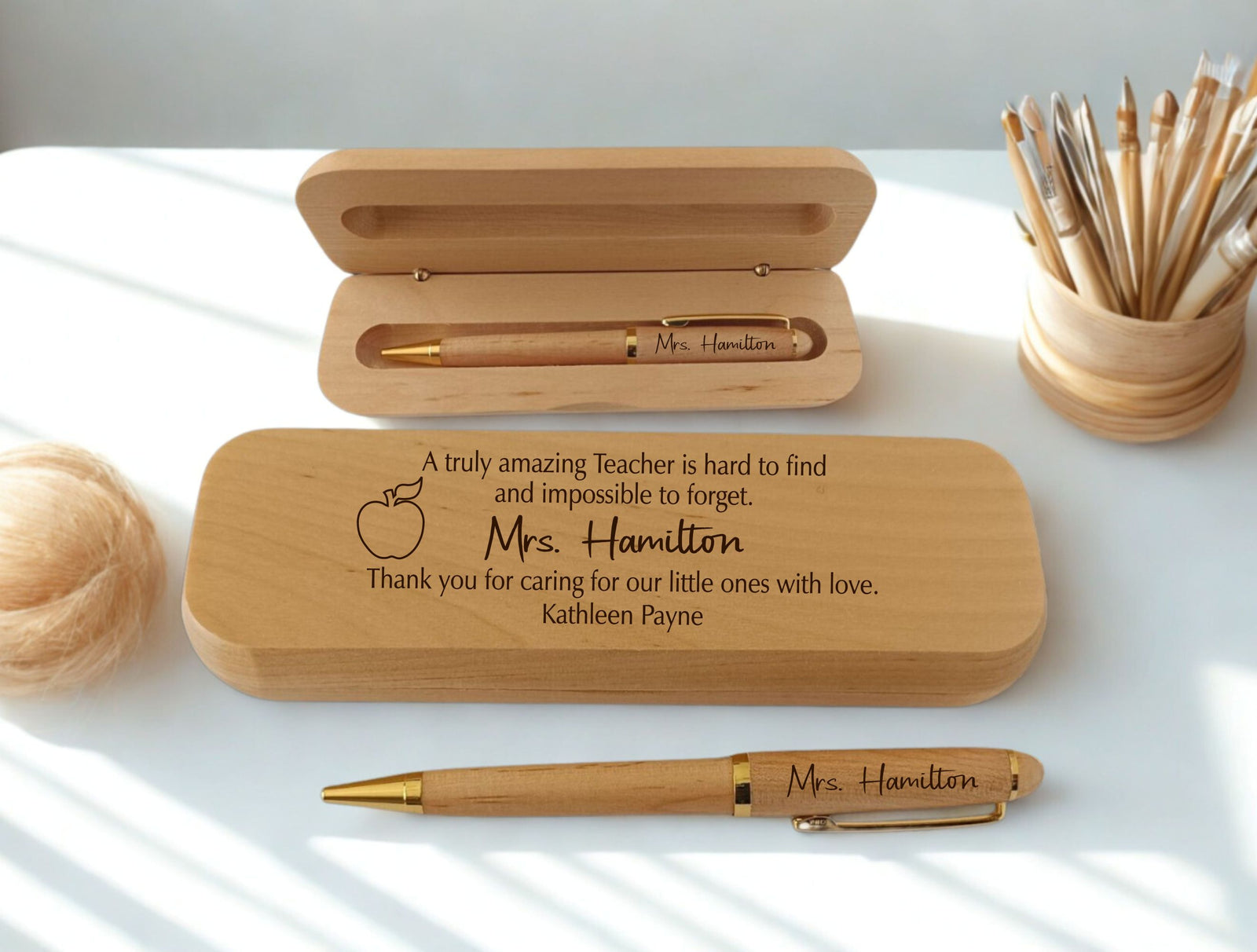Personalized engraved maple wooden pen and gift case set for teacher, laser-engraved with name  and custom appreciation message, displayed open and closed on white surface