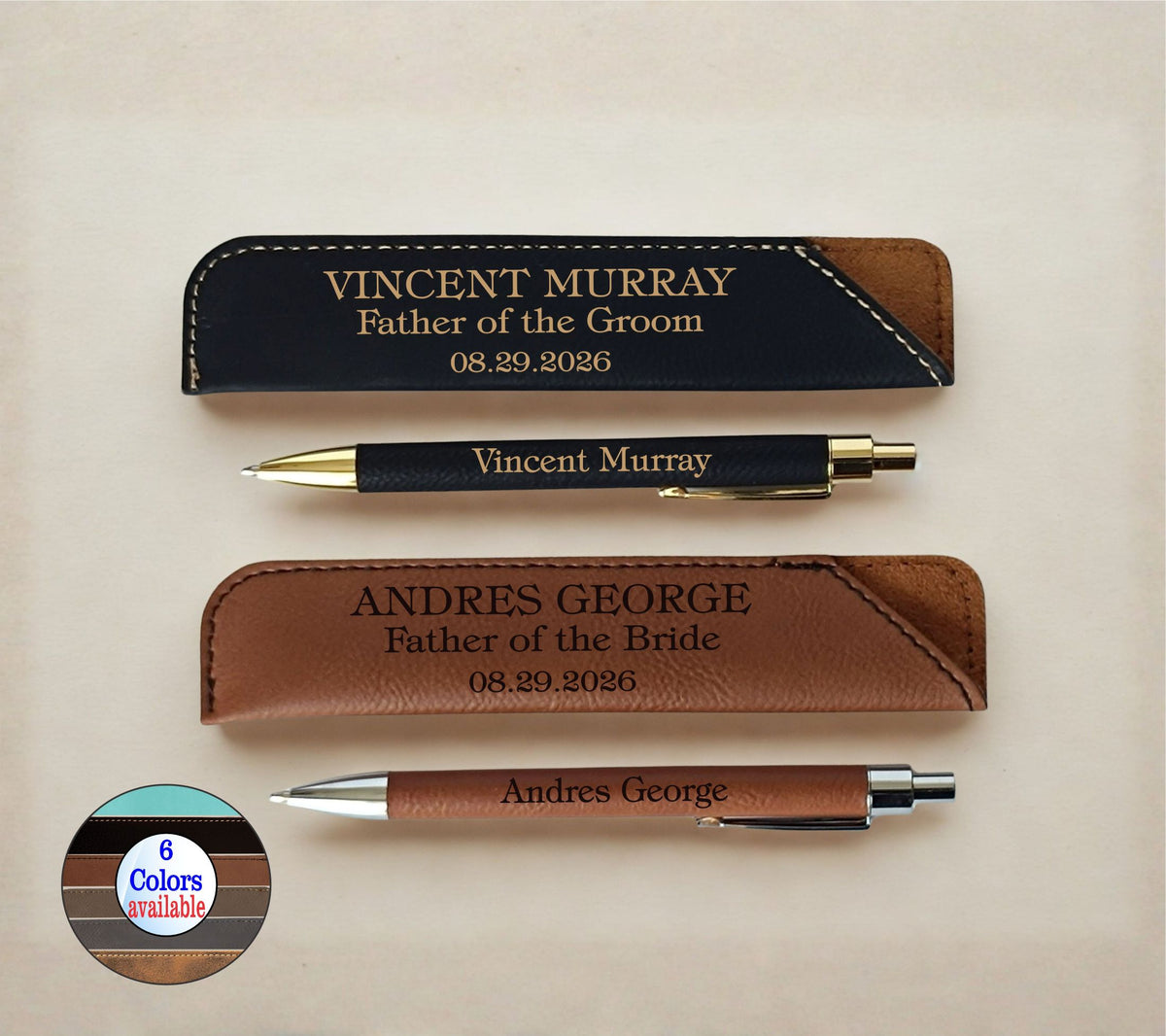 Personalized leather pen sleeves and matching pens on a light beige background. The set includes a black sleeve with gold text, a black pen with gold trim, a brown leather sleeve, and a brown pen with silver and gold trim.