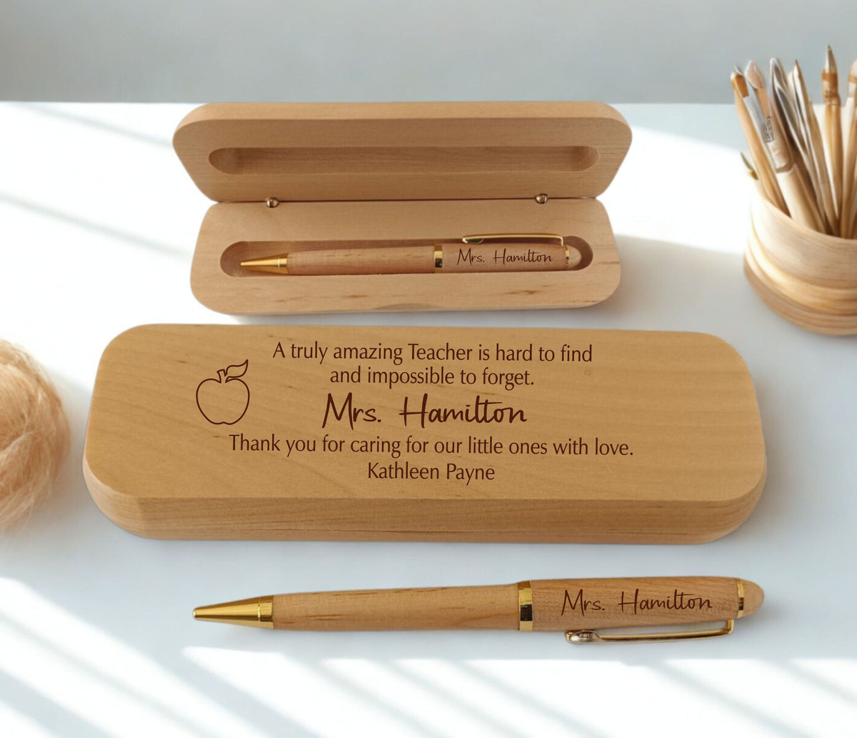 Personalized engraved maple wooden pen and gift case set for teacher, laser-engraved with name  and custom appreciation message, displayed open and closed on white surface